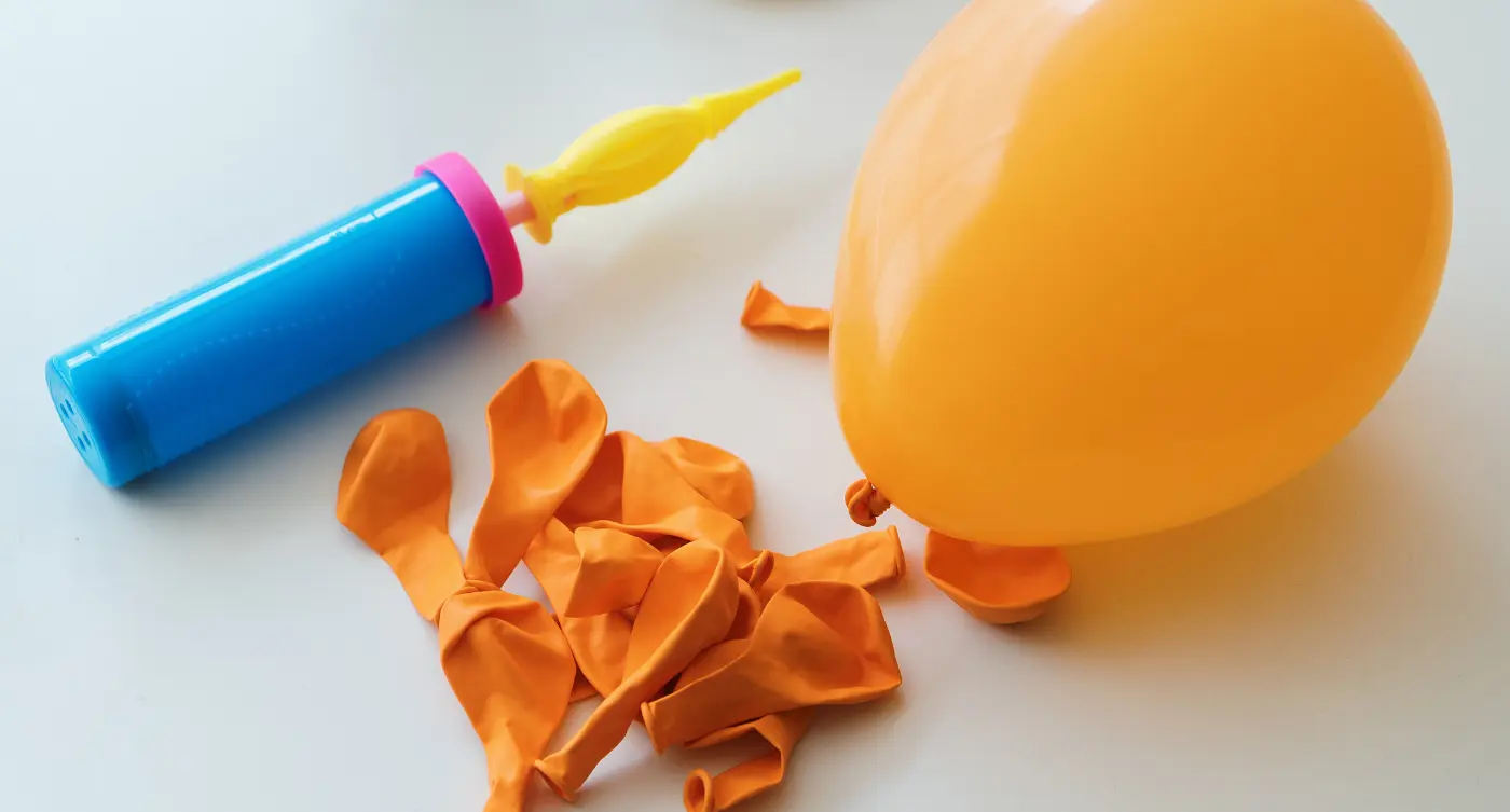 101 Baby Shower Games That'll Wow Your Guests! Balloon Baby Art Challenge